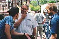 OAC evangelist sharing the gospel with two men in downtown Boston