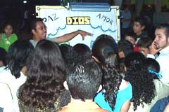 OAC evangelist preaching to a Spanish-speaking crowd